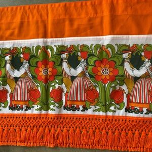 Orange like new folk theme with yarn fringe bottom